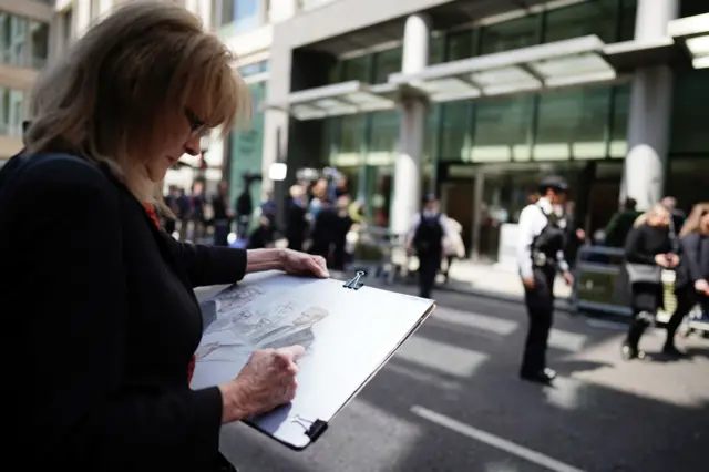 Court artist Elizabeth Cook works on her drawing of the Duke of Sussex giving evidence at the Rolls Building