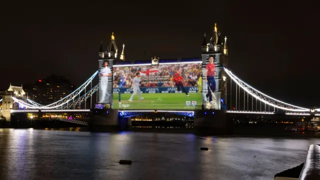 Tower Bridge lit up with an image of Heather Knight and Ben Stokes to promote the Ashes