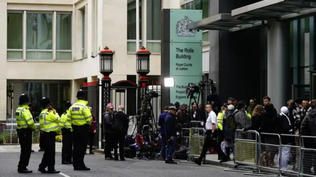 Police officers and members of the media await the arrival of the Duke of Sussex at the Rolls Buildings in central London to give evidence in the phone hacking trial against Mirror Group Newspapers (MGN).Picture date: Wednesday June 7, 2023. P