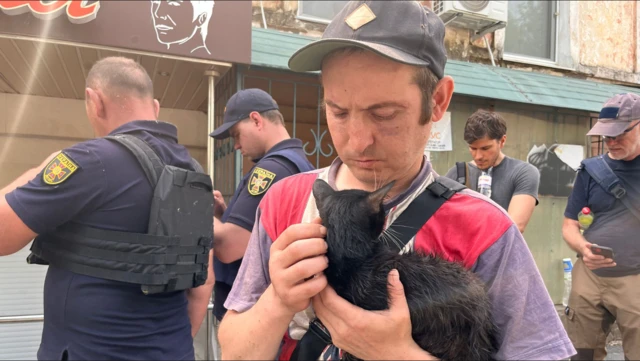 A man holding a cat