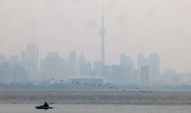 Smoke from forest fires contribute to a hazy view of the skyline from Humber Bay Park West over Toronto. June 6, 2023.