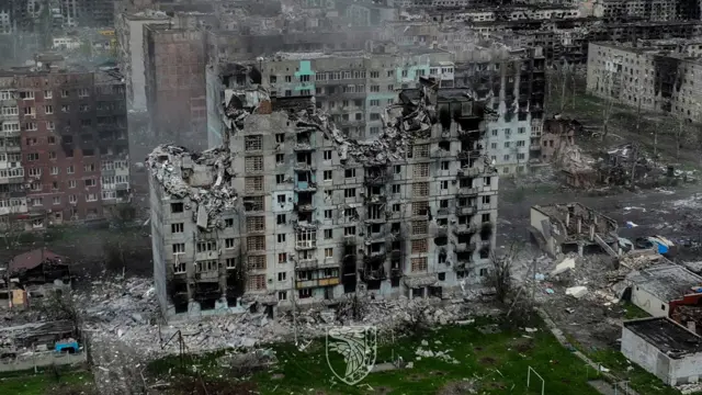 An aerial view shows a destroyed high-rise residental building in Bakhmut