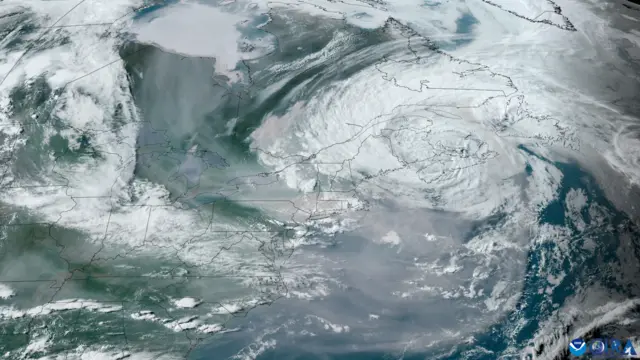 Satellite image showing smoke blanketing over north-eastern US and Canada