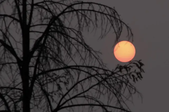 A reddish sun over New York on Tuesday