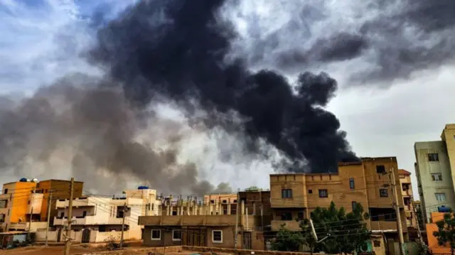 Smoke plumes billow from a fire at a lumber warehouse in southern Khartoum amidst ongoing fighting on June 7, 2023