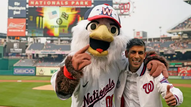 Rishi Sunak pose with Screech, the Washington Nationals Mascot