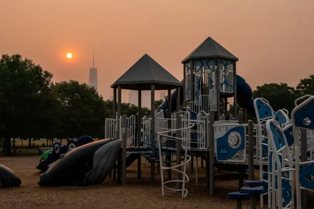 An empty playground in Liberty State Park with One World Trade Center in New York on 8 June 2023