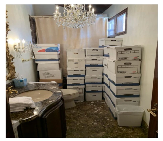 Boxes of documents stored in a bathroom, as filed in an indictment against Donald Trump.