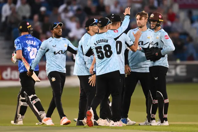 Surrey celebrate a wicket against Sussex