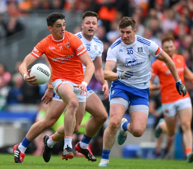 Rory Grugan of Armagh in action against Darren Hughes of Monaghan