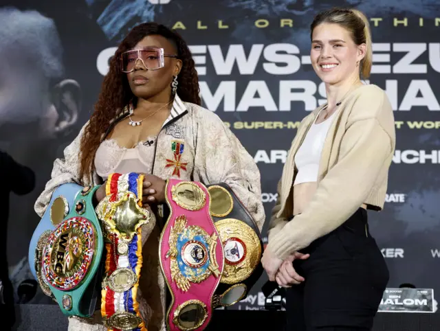 Franchon Crews-Dezurn holds the super-middleweight titles next to Savannah Marshall