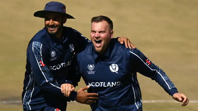 Safyaan Sharif and Mark Watt celebrate