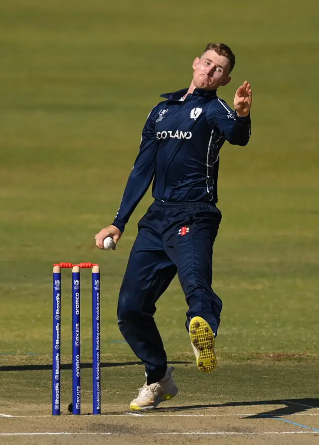 Brandon McMullen bowls during his opening spell