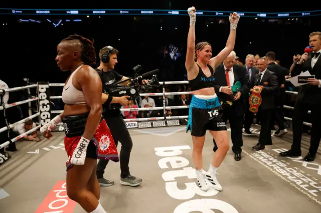 Savannah Marshall celebrates as Franchon Crews-Dezurn walks away