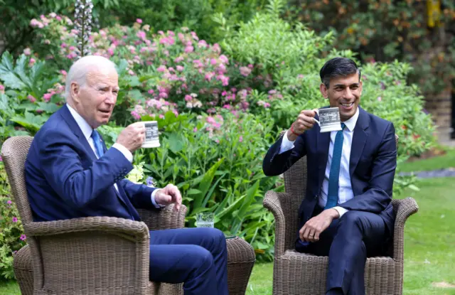 Biden and Sunak having tea