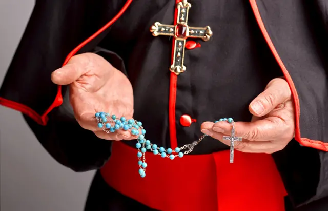 Cardinal with rosary