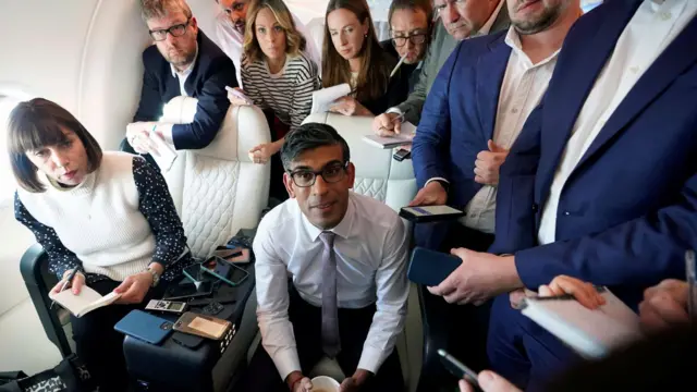 Prime Minister Rishi Sunak with journalists on a government plane as he heads to Washington, 6 June.