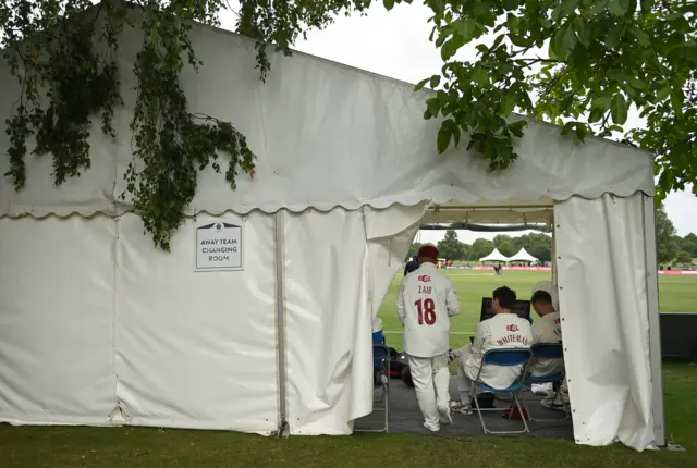 Northamptonshire players watching the action