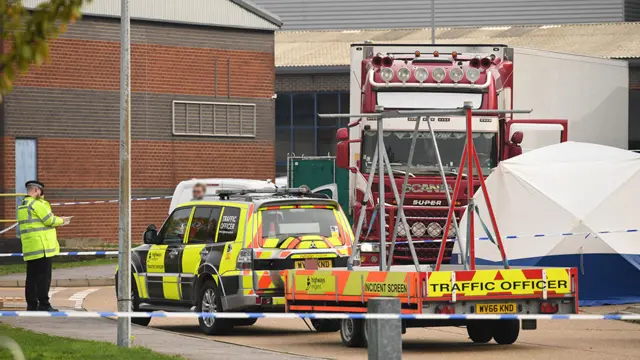 Police activity at the Waterglade Industrial Park in Grays, Essex, after 39 bodies were found inside a lorry container