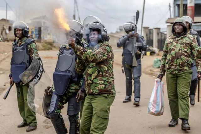 Security officers fire tear gas in Nairobi.