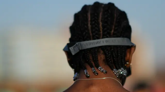 A man with braided hair.