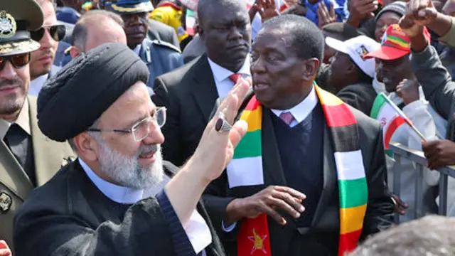 Iran's President Ebrahim Raisi (L) is welcomed with an official ceremony by President of Zimbabwe Emmerson Mnangagwa (R) in Harare, Zimbabwe - 13 July 2023