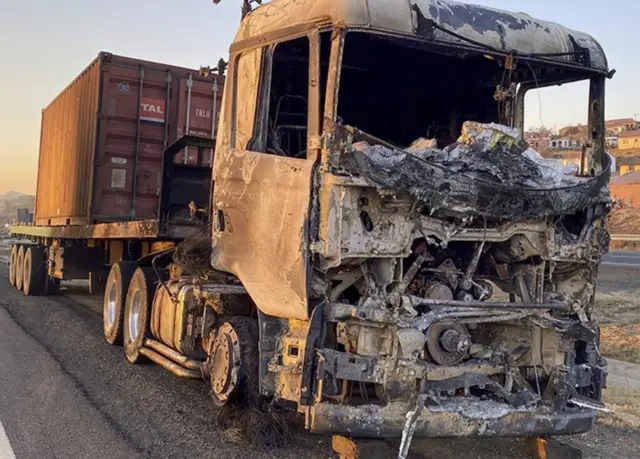 A burnt-out lorry