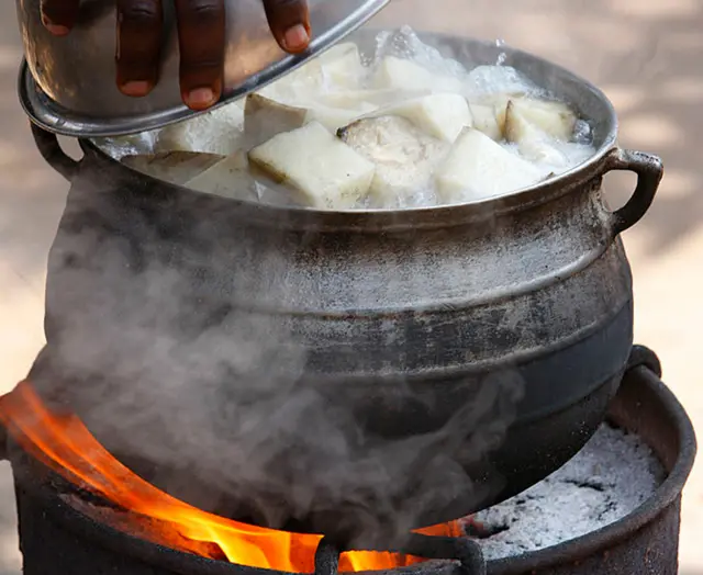 Yams cooking in a pot in Togo