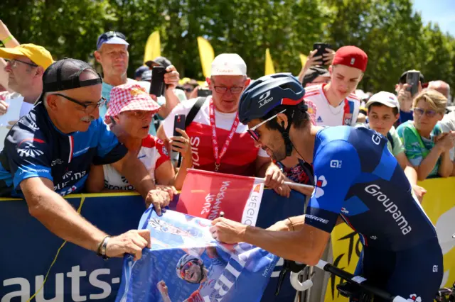 Thibaut Pinot signs autographs