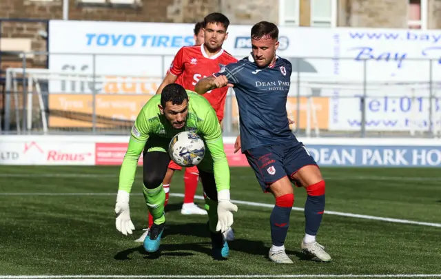 Dunfermline's keeper Deniz Mehmet dives for the ball