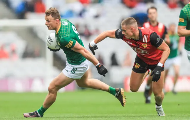 Meath's Ronan Jones with Pat Havern of Down