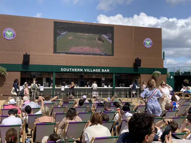 Fans watching tennis