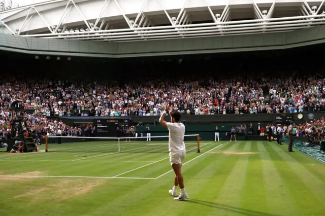 Carlos Alcaraz applauds Centre Court