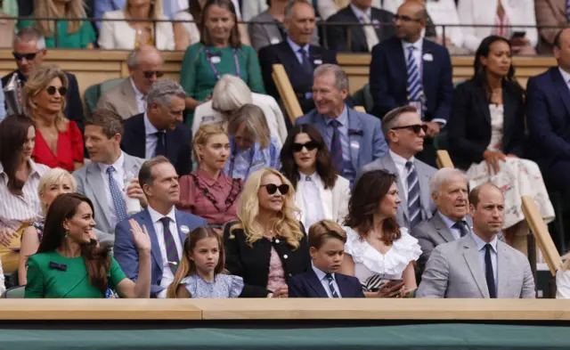 Britain's Catherine, Princess of Wales, Princess Charlotte, Prince George and Britain's Prince William, Prince of Wales in the royal box ahead of the men's singles final