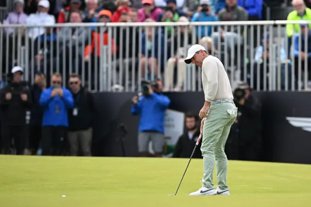 Rory McIlroy holes the winning putt