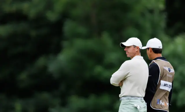 McIlroy with his caddie