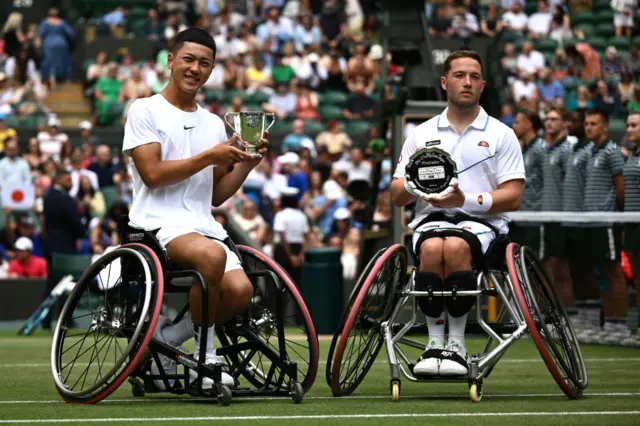 Oda and Hewett pose with their trophies