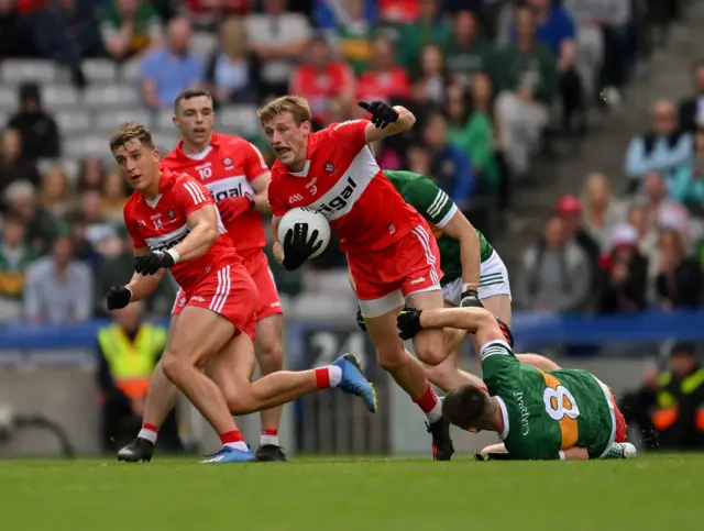 Brendan Rogers of Derry is tackled by Diarmuid O'Connor of Kerry