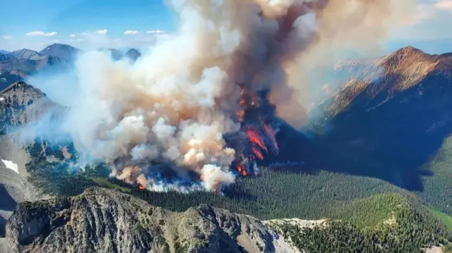 Smoke rises from the Texas Creek wildfire (K71415) south of Lillooet, British Columbia, Canada July 9, 2023.