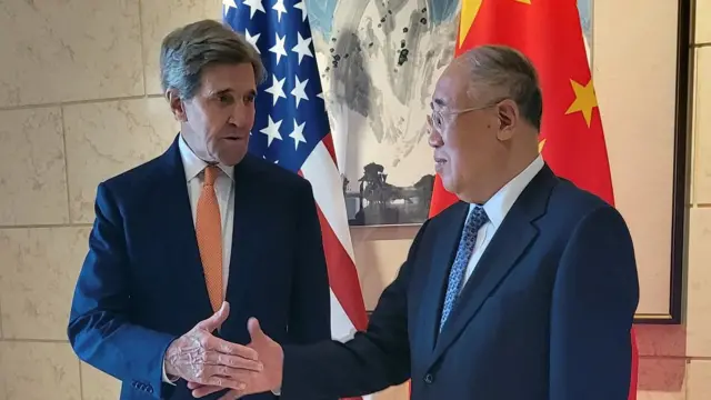 U.S. Special Presidential Envoy for Climate John Kerry shakes hands with his Chinese counterpart Xie Zhenhua before a meeting in Beijing, China on Monday