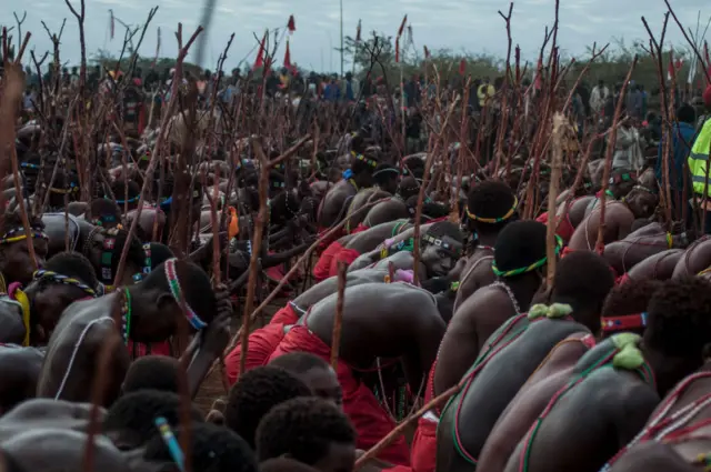 An initiate looks on during a ceremony in Elim, South Africa, on July 15, 2023. More than 1500 Tsonga and Venda initiates under the Mashamba Traditional Authority returned home to a tumultuous welcome after undergoing their rite passage in Ha-Mashamba, Limpopo Province. They were part of a total of 68 000 young men and women who underwent the rite of passage in Limpopo province.