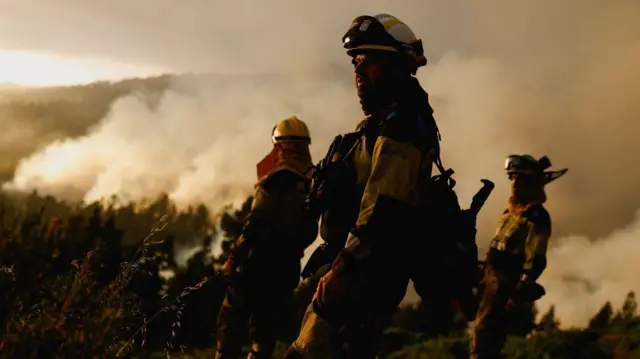 Firefighter works on Canary Island of La Palma to tackle wildfire