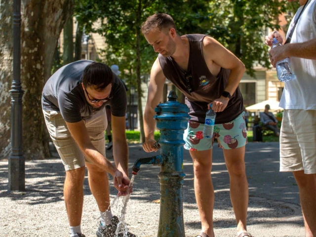 Citizens refresh themselves at a water tap in Croatia, where temperatures are expected to rise up to 40C in the coming days