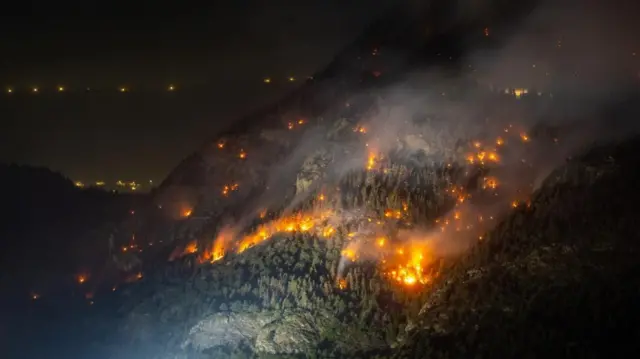 General view of a wildfire on the flank of a mountain in Bitsch near Brig, Switzerland