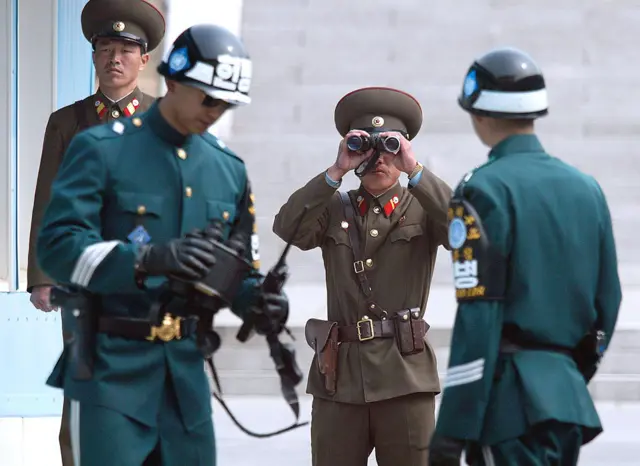 A North Korean soldier surveys the Demilitarized Zone