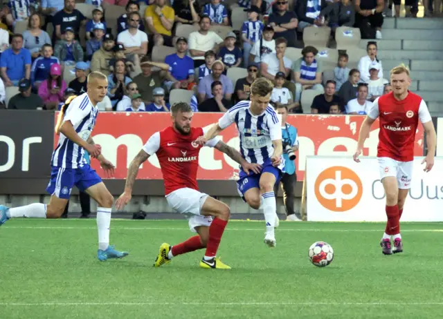 Larne’s Andy Ryan gets away from HJK Helsinki’s Keskinen and Lingmann