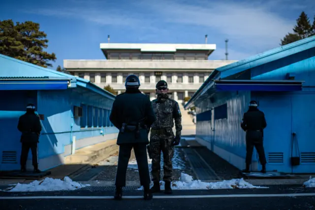 South Korean soldiers stand guard at the border village of Panmunjom