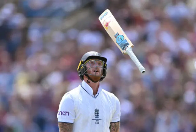 Ben Stokes throwing his bat in the air after getting out