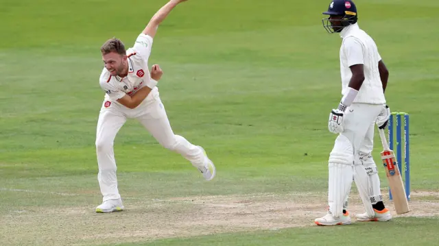 Sam Cook bowling for Essex