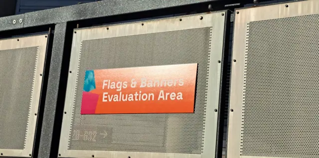 Sign saying 'Flags and banners evaluation area'